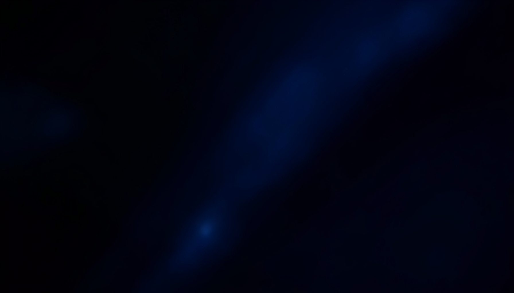 Dark navy and deep blue abstract backdrop with soft glowing highlights, conveying a sleek and immersive gaming atmosphere