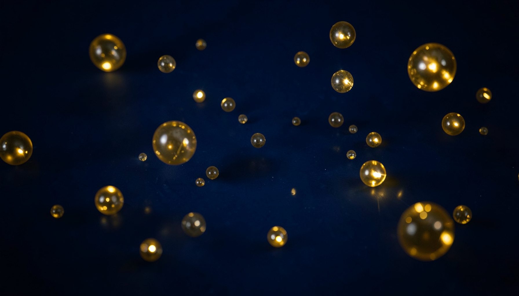 Dark atmospheric background with glowing golden lottery balls scattered across a deep navy-blue surface, conveying anticipation